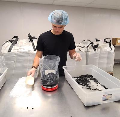 guy sorting stuff in plastic container