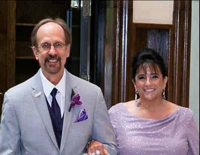 Greg and Camille Baroni smile at the camera.