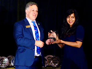 Melissa Perera receives an emerging business leader award.