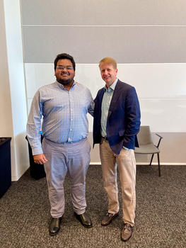 Kyle Samuel (left) poses with David Marriott, grandson of the founder of Marriott